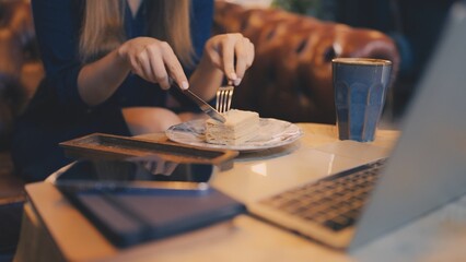 Closeup of woman enjoying cake and coffee in cafe, relaxed urban lifestyle