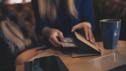 Closeup of customer paying coffee bill, tipping waiter, supporting small business