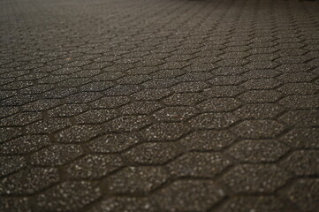 пятиугольна плитка як фон в старому місті, сіра плитка 