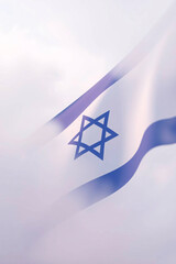 Close-up of Israel's flag with the Star of David and blue stripes on a white background.