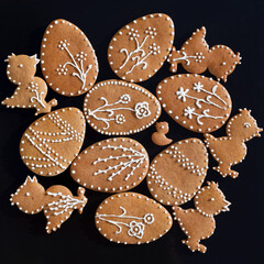 Romantic decorated Easter gingerbread cookies in a shape of egg and chicken