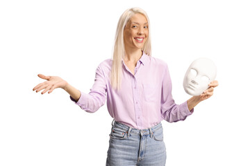 Obraz premium Woman holding a white masquerade mask
