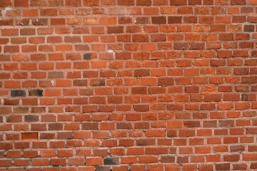Red brick wall texture. Classic masonry pattern with rough surface. Ideal for architectural backgrounds, vintage design, construction themes, or texture overlays.