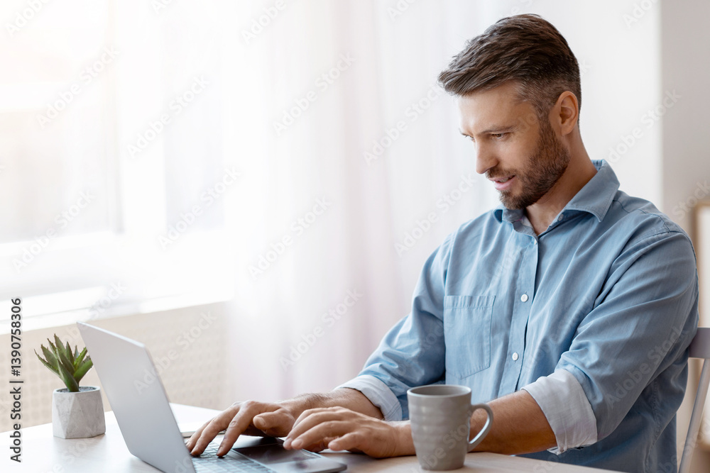 Poster unemployed man scrolling job search website at home using laptop computer, handsome male freelancer 