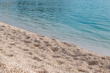 The seashore of the Adriatic sea in Croatia. Pebble beach on the Adriatic sea. The pure sea water.
