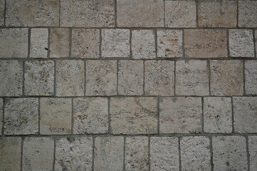 grey natural stone pavement texture, square tiles background for architecture, design, flooring, construction and urban projects