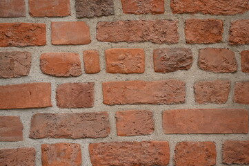 Red brick wall close up background. Vintage masonry texture of red bricks with mortar