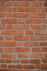 texture of a red brick wall with mortar lines. Old masonry background suitable for architecture, construction, renovation, urban design, and industrial themes. Perfect for use in textures, patterns