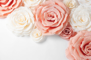Beautiful paper flowers on white background, flat lay. Space for text