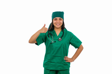 Latin female surgeon gesturing thumbs up wearing green scrubs and stethoscope