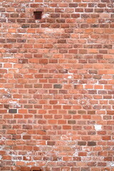 red brick wall texture close-up as background texture of a red brick wall with visible mortar lines and natural wear. ideal as a background for architectural, construction, design, or urban visuals.