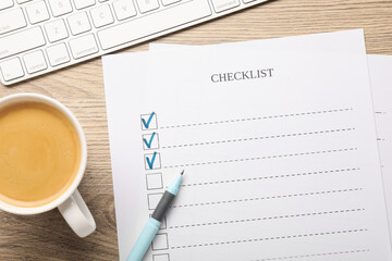 Checklist with marked checkboxes, pen, coffee and computer keyboard on wooden table, flat lay
