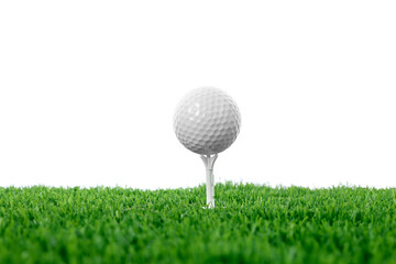 Golf ball, tee and green grass against white background