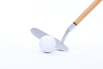 Golf ball and club on white background, closeup