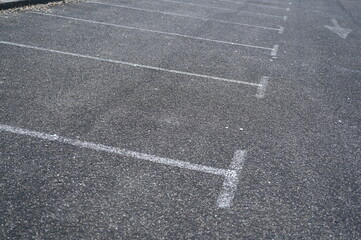 white arrow on gray asphalt, turn left, turn right, abstract white lines on asphalt, background of asphalt texture and white lines	
