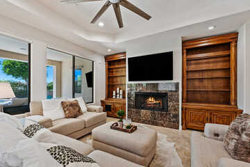 Cozy living room with a warm fireplace and modern flat screen TV
