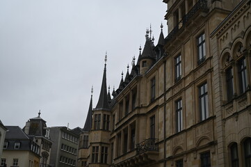 Fototapeta premium Grand Ducal Palace in Luxembourg City, historic architecture with tower and ornate stone facade. Famous European landmark and travel destination.