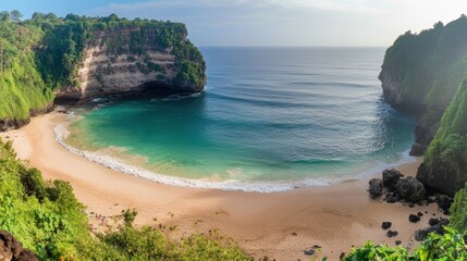 Kelingking beach nusa penida bali indonesia: turquoise water washes the sandy shore