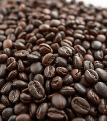 Naklejka premium Dark roasted coffee beans, close-up view, rich texture, dark, detail, dark background
