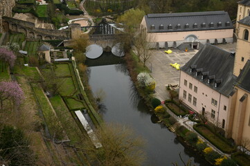 Aerial view of the historic European city center with old buildings, church towers, and green hills. Perfect for travel agencies, tourism marketing, architecture firms, and hospitality branding. The p