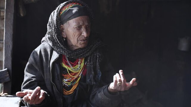 Kalash People. Oldest Woman in Bumburet Valley, Grandmother Kalashi. Elder woman in Hut at Winter, Chitral, Pakistan.