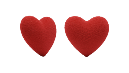 A pair of red plush heart-shaped pillows set against a stark black backdrop evokes themes of love, affection, and soft comfort. 