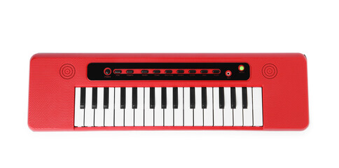 Red toy electric piano isolated on white, top view