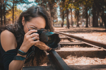 Photographer taking pictures outside, professional photographer, concept for world photography day, copy space