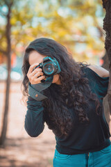 Photographer taking pictures outside, professional photographer, concept for world photography day, copy space
