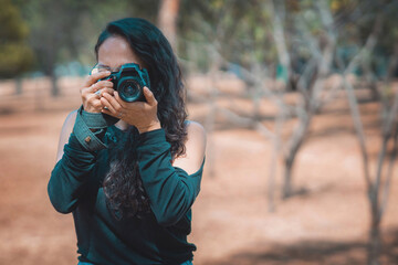 Photographer taking pictures outside, professional photographer, concept for world photography day, copy space