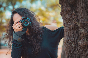 Photographer taking pictures outside, professional photographer, concept for world photography day, copy space