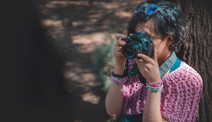 Photographer taking pictures outside, professional photographer, concept for world photography day, copy space