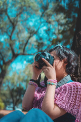 Photographer taking pictures outside, professional photographer, concept for world photography day, copy space