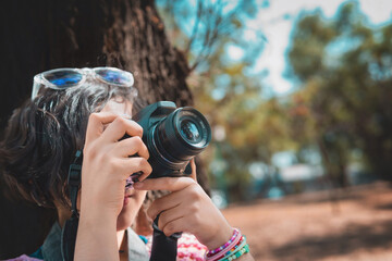 Photographer taking pictures outside, professional photographer, concept for world photography day, copy space