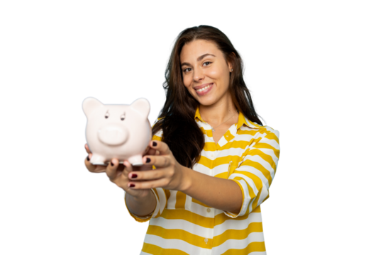 Woman saving money, grinning while clutching pink piggy bank