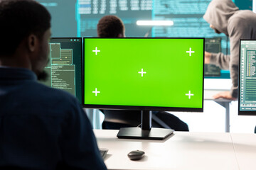 Governmental hackers working on computer with green screen to protect data and network security....