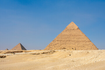 Great Sphinx and Great Pyramid of Cheops, Cairo, Egypt. Ancient statue of Sphinx, mythical creature with head of man and body of a lion, Giza pyramid complex (Giza Necropolis)