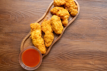 fried chicken in a glass bowl and ketchup