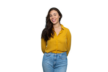 Young woman smiling confidently, standing with hands clasped behind back, studio headshot against...
