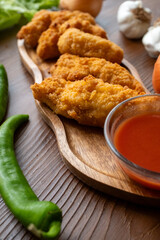 fried chicken in a glass bowl and ketchup