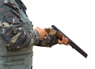 Pheasant hunters with shotgun walking through a meadow.