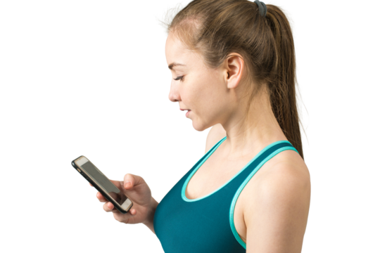 A young slim athletic girl in sportswear with snakeskin prints performs a set of exercises.