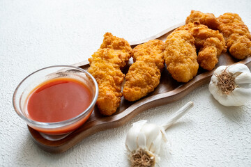 fried chicken in a glass bowl and ketchup