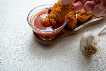 fried chicken in a glass bowl and ketchup