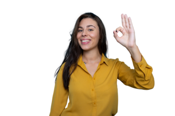 Young businesswoman smiling and gesturing okay sign, isolated on transparent background