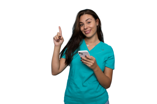 Female medical professional in turquoise scrubs gesturing upward while using smartphone, standing against transparent backdrop