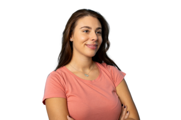 Smiling woman standing with crossed arms, turning head sideways, wearing casual outfit against transparent backdrop