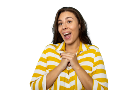 Cheerful young woman clasping hands, expressing surprise and excitement during studio photoshoot against transparent background