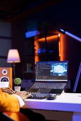 Computer scientist using laptop, updating artificial intelligence neural networks, writing binary...