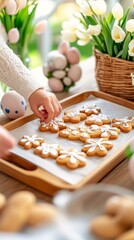  Child decorating homemade cookies with icing in cozy spring setting, surrounded by tulips and Easter eggs